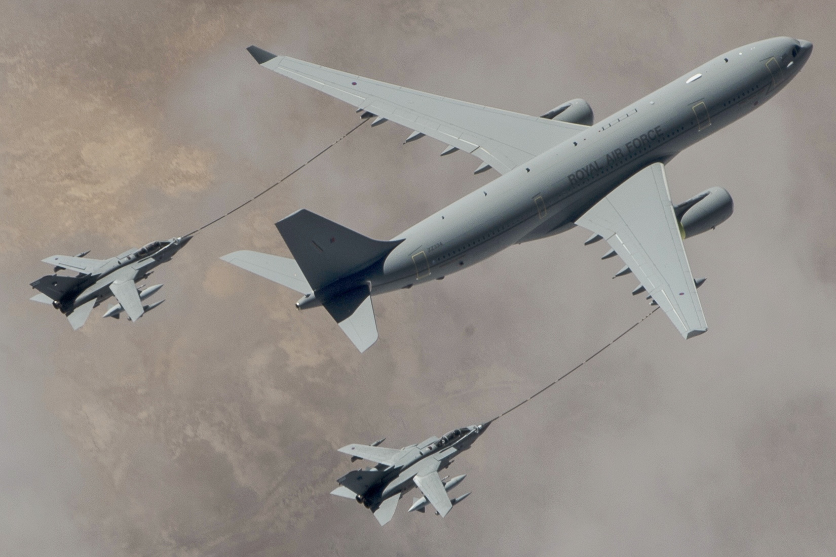 RAF Voyager KC3 tanker refuelling two Tornado GR4 jets in flight